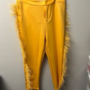 Gold fringed pants, tapered at the ankle. Brand new never worn.